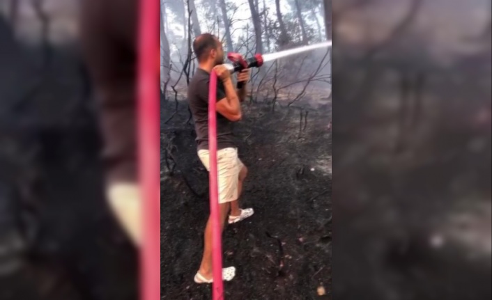 Tatile giden Adanalı gençler, yangına müdahale etti