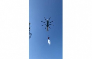 Helikopterin soğutma çalışmasını çeken muhabirler...